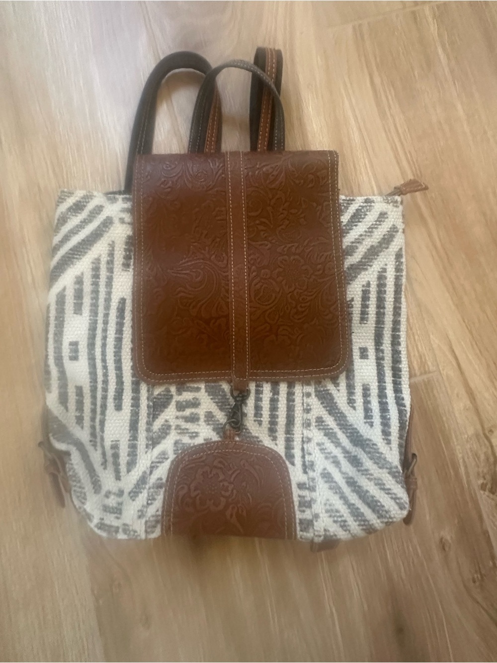 Myra Bag white and gray woven canvas body with brown embossed leather accents